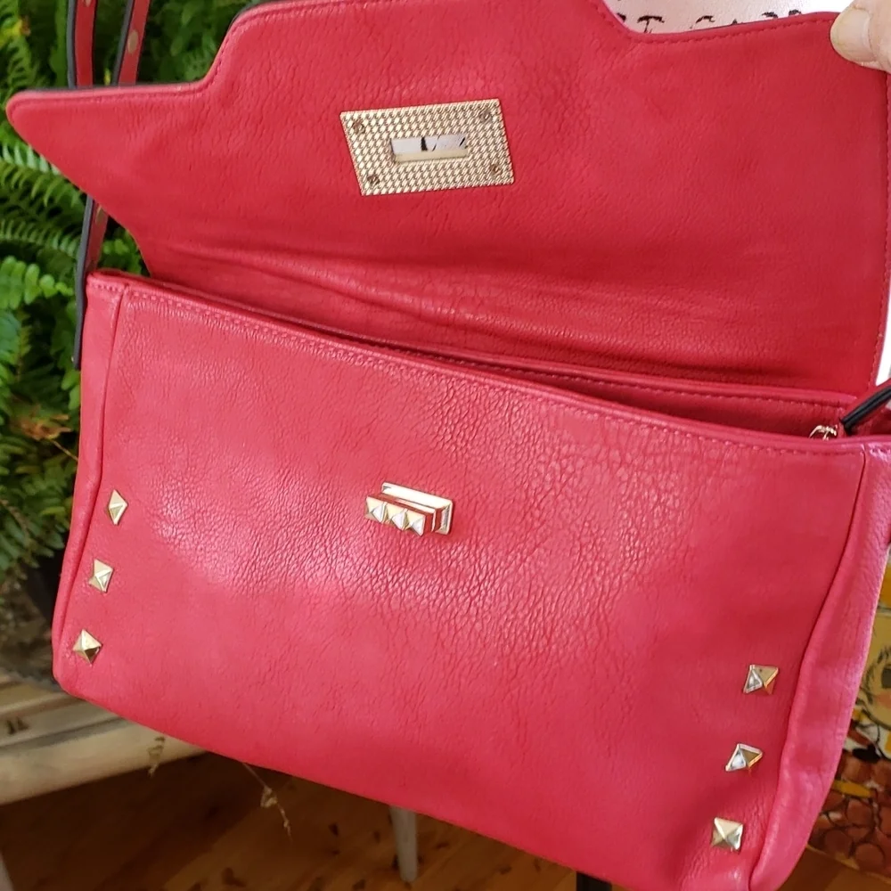 RED studded-embellished lipstick red vegan leather shoulder bag